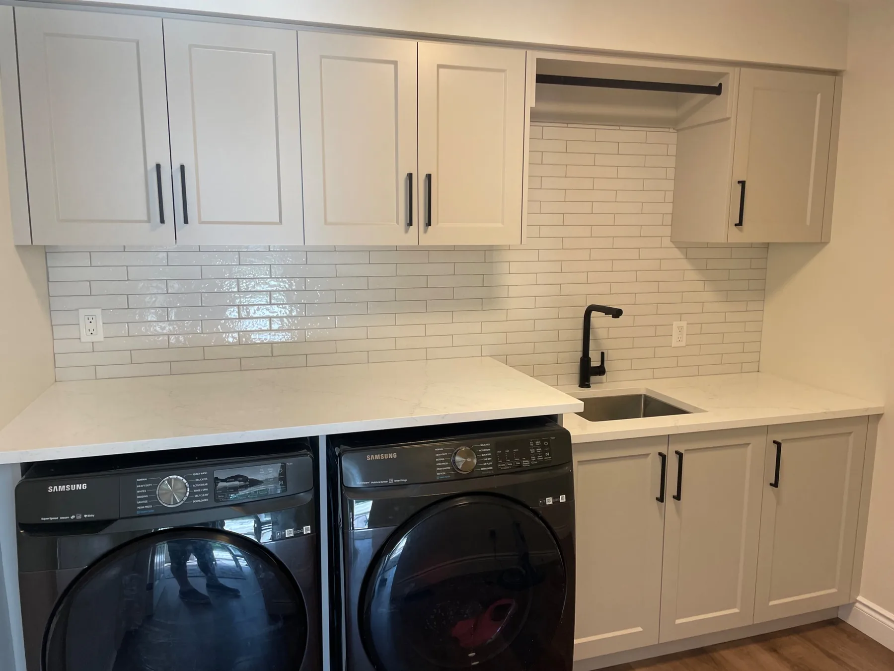 Custom laundry room cabinetry and sink